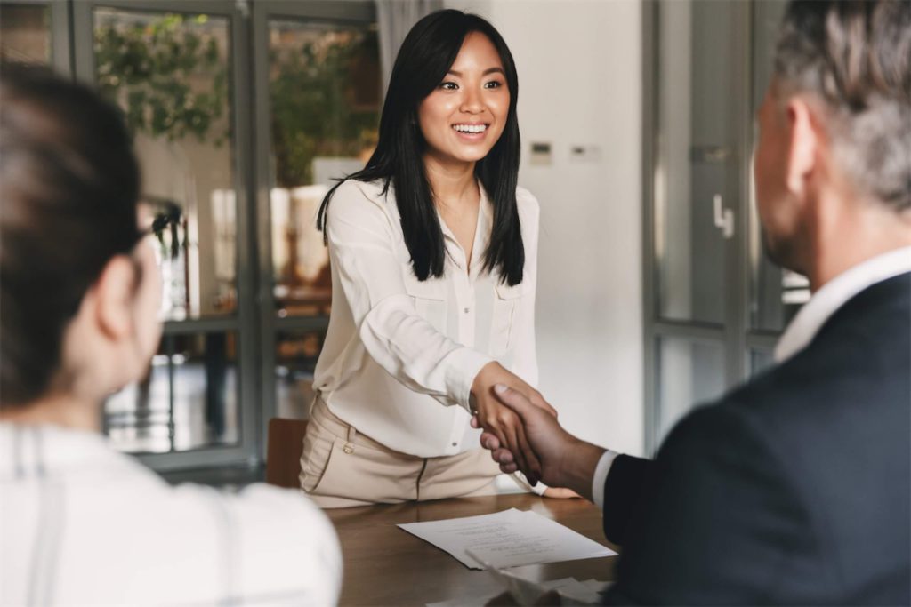 woman-shaking-hands-with-business-partner