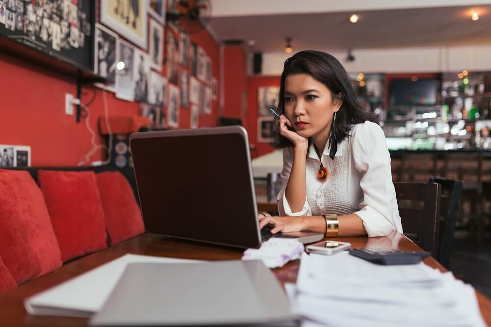 Young business owner browsing business line of credit payment structures