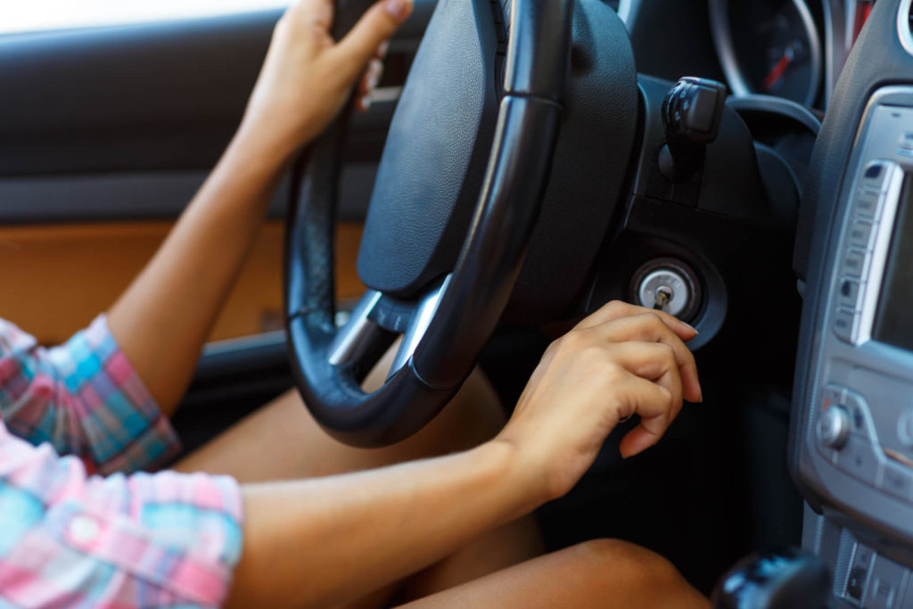 An individual starting up their car, which was bought via a hire purchase agreement