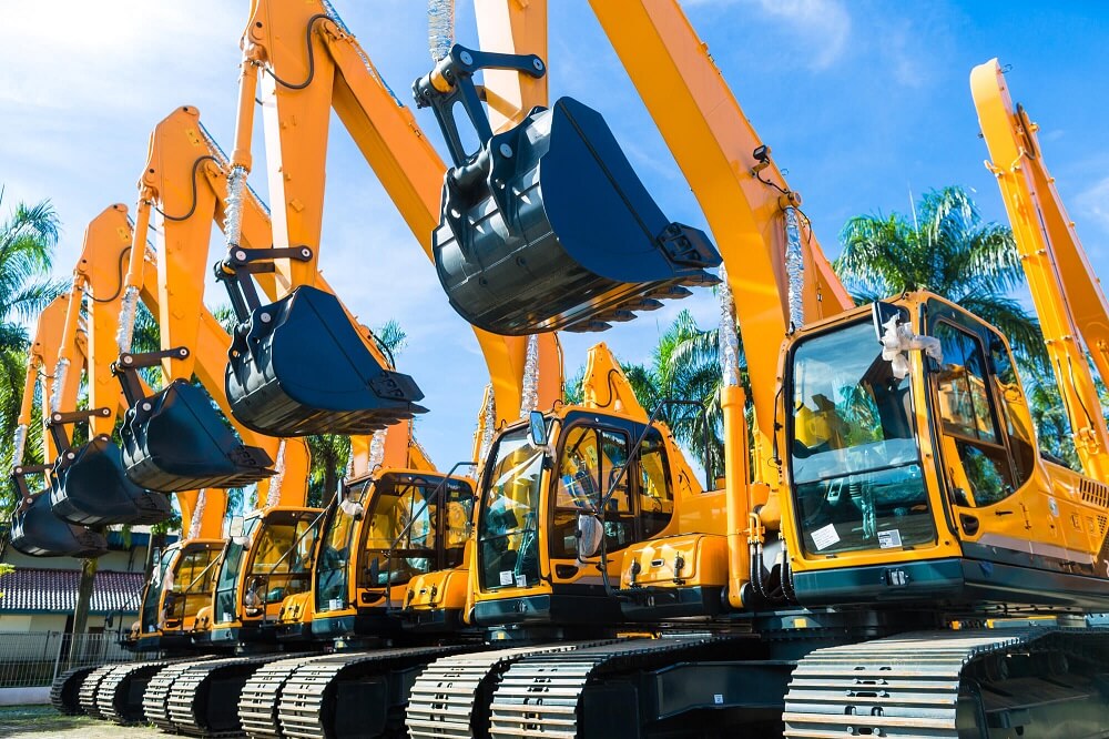 Image of 5 shovel excavators, one of the heavy machinery ideal for a hire purchase agreement