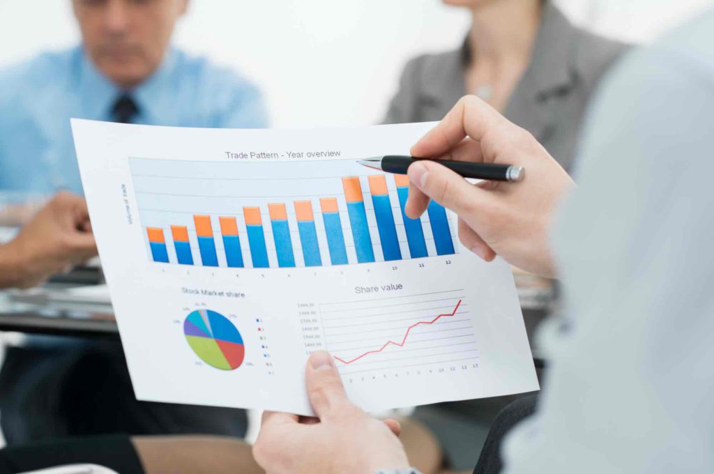 Man analysing his business’ yearly revenue to check if they are eligible for the Temporary Bridging Loan Programme in Singapore