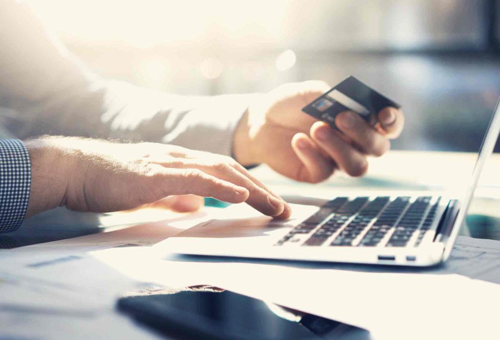 Businessman getting ready to spend from a business debit card